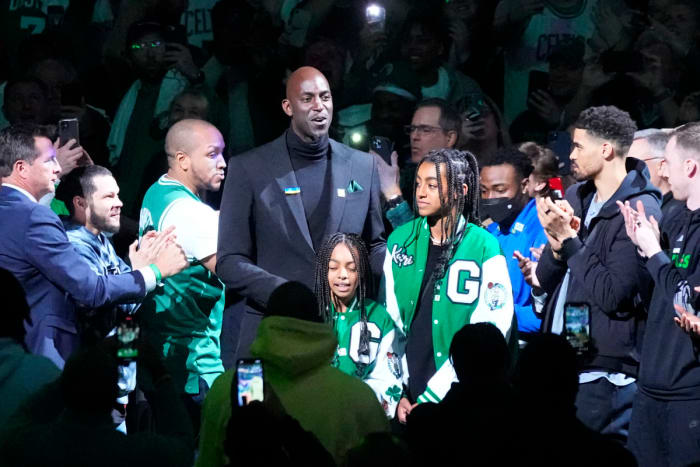 Basketball Hall of Fame and former Boston Celtic and Kevin Garnett is introduced and walks out onto the court with his daughter during his number retirement ceremony after game between the Boston Celtics and the Dallas Mavericks at TD Garden.